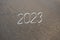Figures for the upcoming New Year 2023 on the sand
