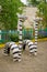 Figures of zebras made of wood and automobile tires on playground