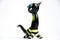 Figurine black cat made of glass on a white background handmade as a souvenir