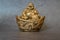 Figurine Cheerful Hotei - Image. Smiling Buddha - Chinese God of Happiness, Wealth and Lucky Isolated on gray - Image