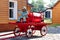 A figurine of a fireman`s beaver on a cart.