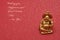 Figurine of a laughing and cheerful golden Buddha