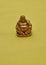 Figurine of a laughing and cheerful golden Buddha