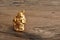 Figurine of laughing golden Buddha