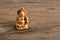 Figurine of laughing golden Buddha