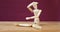 Figurine performing stretching exercise