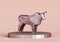 figurine of a simplified polygonal metal bull on a stand