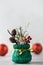 A figurine of a tiger in a Christmas sack against the background of Christmas balls. Chinese New Year concept.