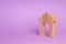 Figurine of a wooden house with a large doorway. Concept of real estate, purchase and sale of housing. Affordable housing