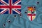 Fiji flag Close-up shot on waving background texture with bullet holes. The concept of design solutions. 3d rendering