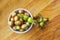 Filberts or hazelnuts and leaves on the wooden surface. Top view.