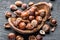 Filberts or hazelnuts in the wooden bowl on the table.