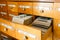 A file cabinet or cabinet with an open drawer and files. Database concept. File cabinet with library or office. Two