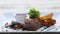Filet mignon beef steak on beach table in luxury resort outdoors restaurant