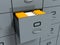 Filing office cabinet with yellow folders