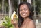 Filipina girl eating banana