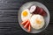 Filipino breakfast Sinangag Garlic rice with fried egg and meat close-up in a plate. Horizontal top view