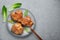 Filipino Chicken Adobo on gray plate on concrete backdrop. Filipino food. Braised chicken thighs