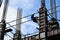 Filipino construction steel-man climbing down using scaffolding pipes on high-rise building