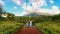 A Filipino couple holding hands at a scenic lake near Mt. Isarog