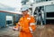 Filipino deck Officer on deck of offshore vessel or ship fills checklist. Paperwork at sea