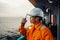 Filipino deck Officer on deck of vessel or ship , wearing PPE personal protective equipment