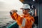 Filipino deck Officer on deck of vessel or ship , wearing PPE personal protective equipment