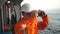 Filipino deck Officer on deck of vessel or ship , wearing PPE personal protective equipment