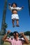 Filipino father tossing baby in the air