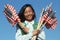 Filipino Girl Scout holding American flags
