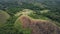 Filipino mounts aerial view: burnt grass on hill top. Deciduous tropical forests with palms, trees