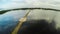 Filipino village with a lake. Anda. Bohol Island. Evening time. Aerial view. Fine artificial road.