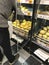 Filipstad/VÃ¤rmland/Sweden,January,03.2020-Customer stands in front of baked goods shelf and packs rolls in a Swedish supermarket