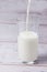 Fill glass milk. White drink. Light background