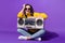 Fill size photo of charming positive lady sit hold boombox beaming smile isolated on violet color background