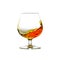 A filled cognac snifter with moving liquid