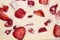 Filled frame background wallpaper shot of strawberries on the surface of a yellow orange vanilla cheese cake cream liquid