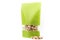 Filled green paper biodegradable doy pack flexible packaging with window and zipper on white background