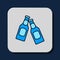 Filled outline Beer bottle icon isolated on blue background. Vector