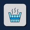 Filled outline Sauna bucket icon isolated on blue background. Vector