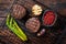 Fillet Mignon grilled Steak with asparagus, beef tenderloin meat. Wooden background. Top view