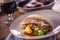 Fillet of zander with vegetables on a plate in a restaurant