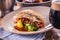 Fillet of zander with vegetables on a plate in a restaurant