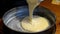 Filling a cake dough mixture into a loaf pan