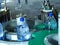 Filling line of sparkling water in pet bottle. Mini factory for