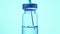 Filling syringe with vaccine from vial, close up. Administrating medication with medical needle syringe and vaccine injection for