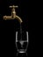 Filling by water of a glass from brass faucet