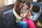 She fills their hearts with so much love. parents bonding with their little daughter at home.