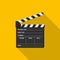 Film clapper board icon on yellow background with shadow. Blank movie clapper cinema