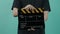 Film crew man hand hold and clap empty black and yellow stripe film slate